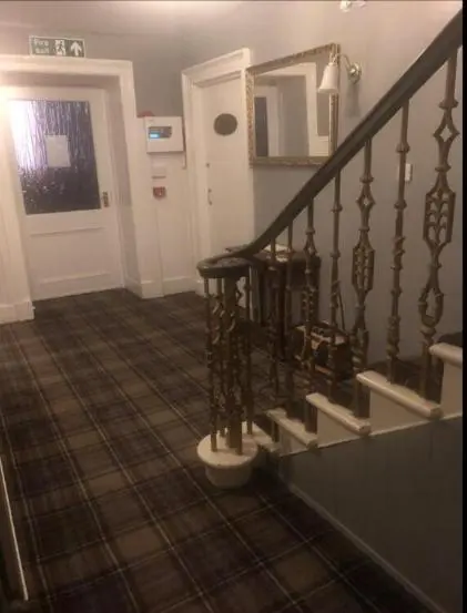a staircase in a house with a stair case at Elgin Guest House in Elgin