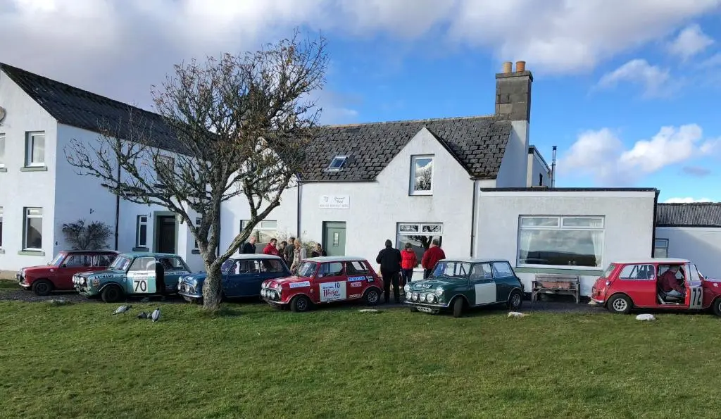 a group of cars parked in front of a house at Garvault House in Kinbrace
