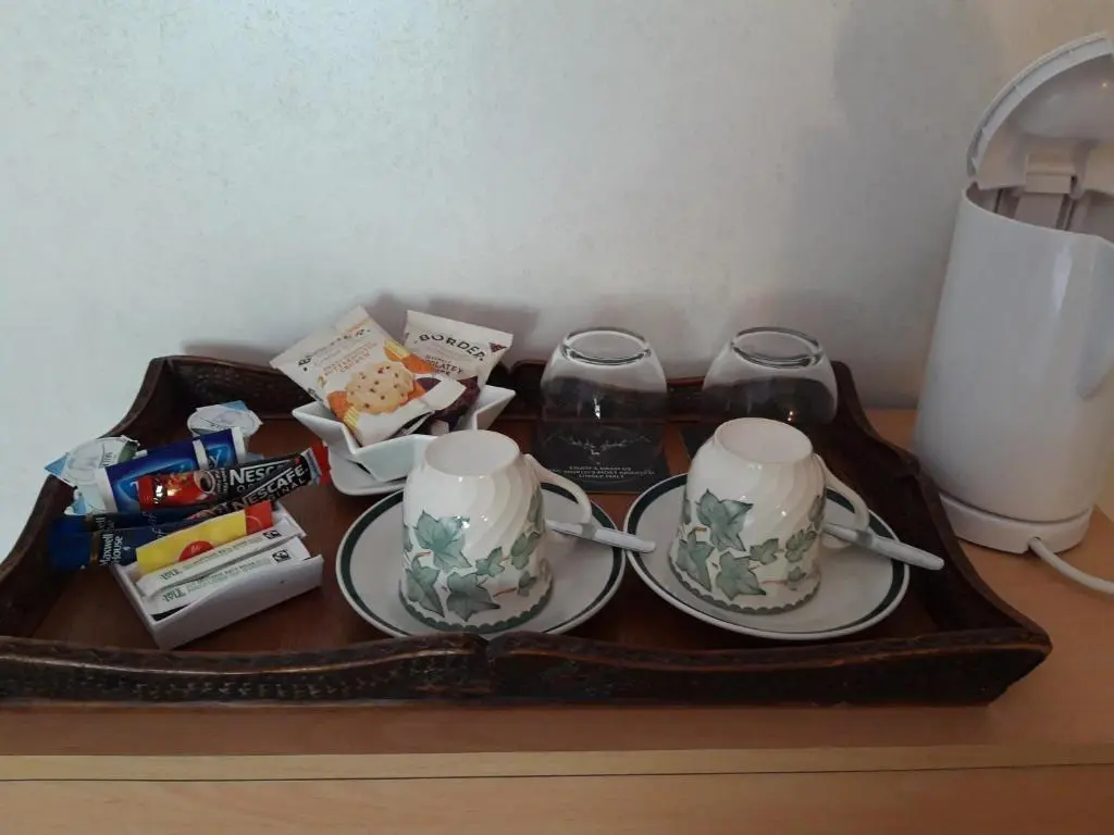 a tray with two cups and other items on a table at Gowanbrae in Dufftown