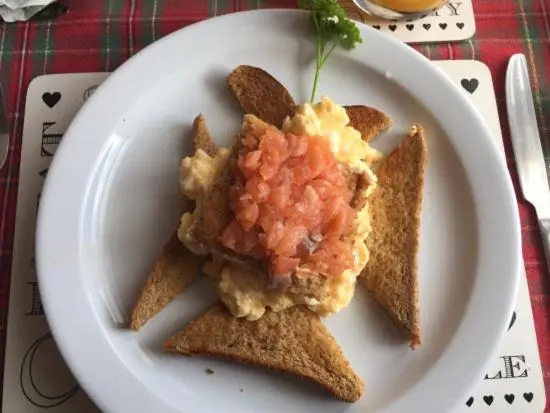 a white plate with some food on some toast at Gowanbrae in Dufftown