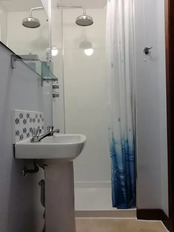 a bathroom with a sink and a shower at Furain in Peterculter