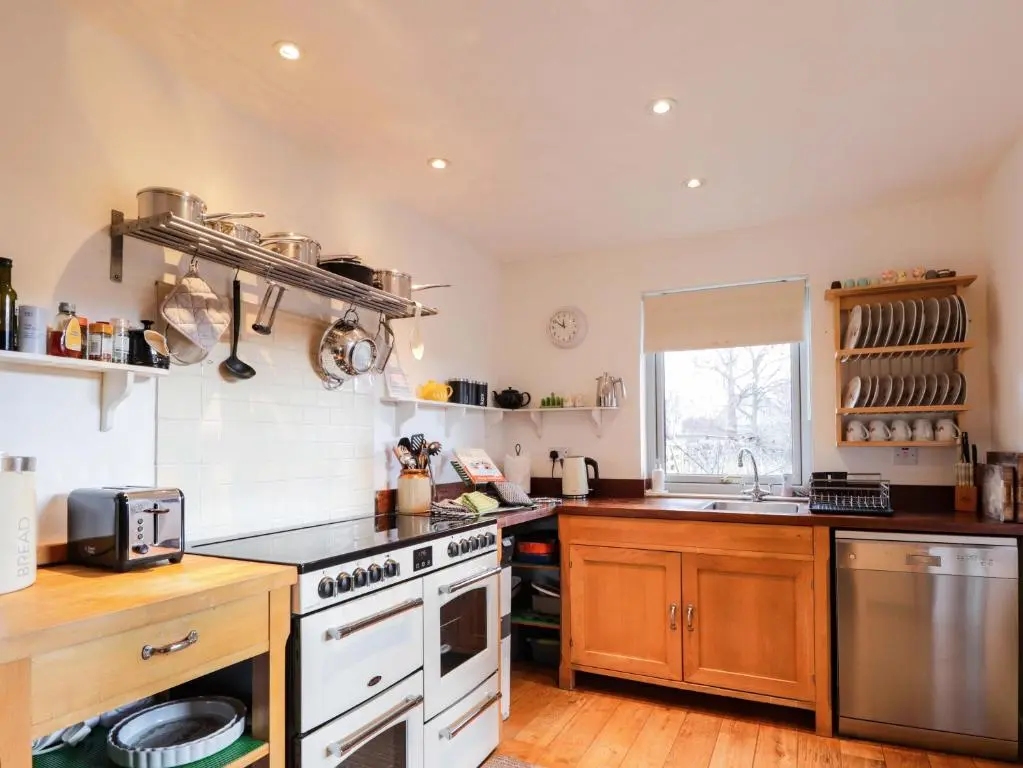 a kitchen with a stove and a sink at Inshcraig in Kincraig
