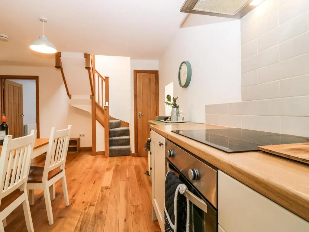 a kitchen with a counter top and a stove top oven at 49 Crovie Village in Gardenstown