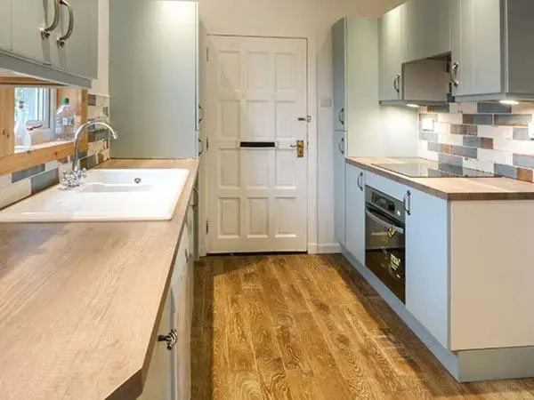 a kitchen with a sink and a counter top at Coorie Doon in Nairn