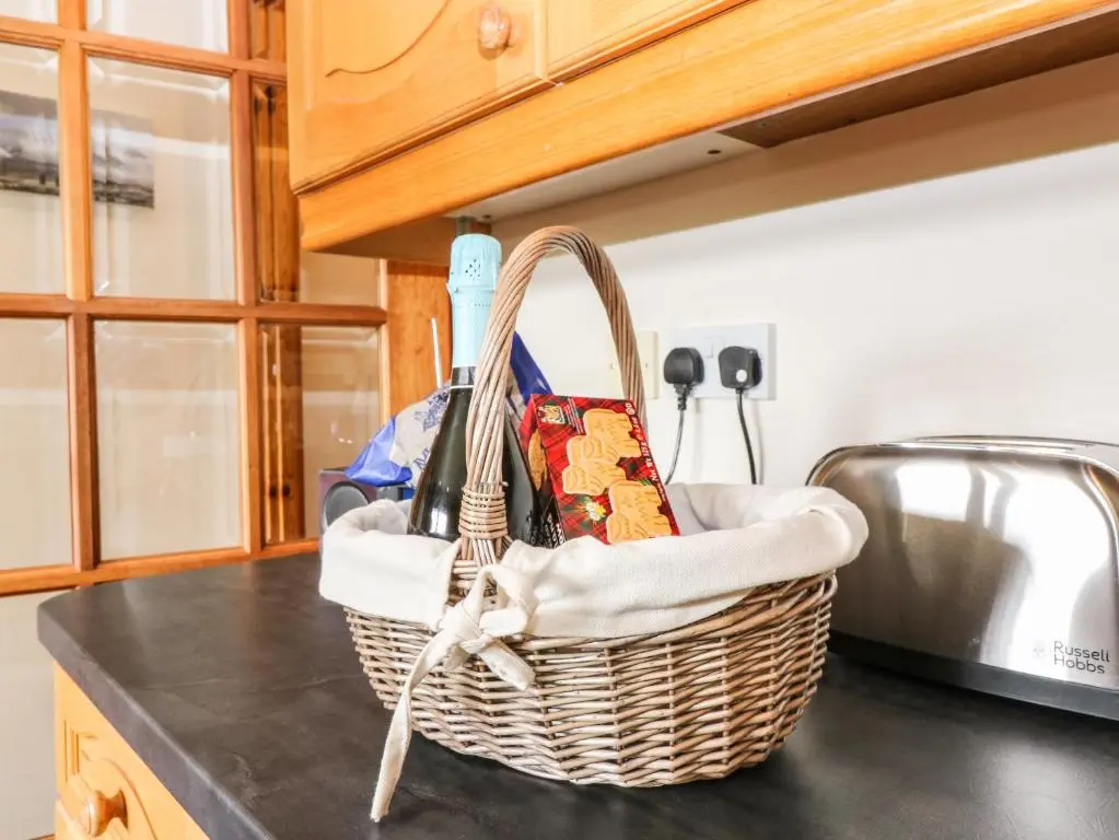 a basket sitting on top of a kitchen counter at Birchbank in Skye of Curr