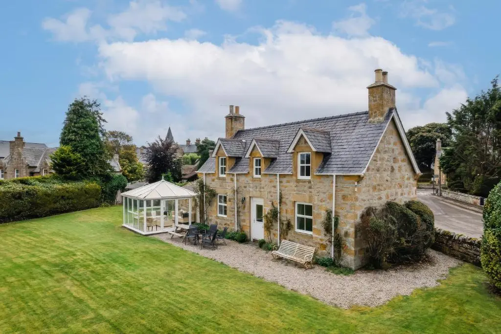 an old stone house with a gazebo at Kerrisdale in Dornoch