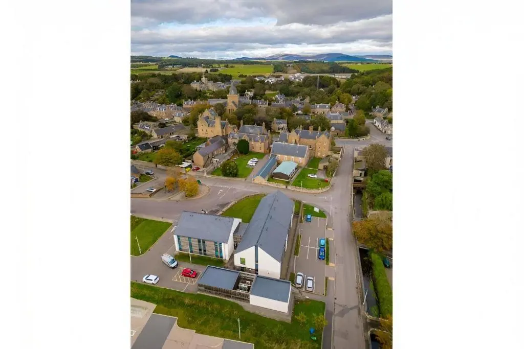 an aerial view of a small town with houses at UHI Dornoch- Campus Accommodation in Dornoch