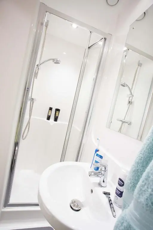 a bathroom with a sink and a shower at UHI Dornoch- Campus Accommodation in Dornoch