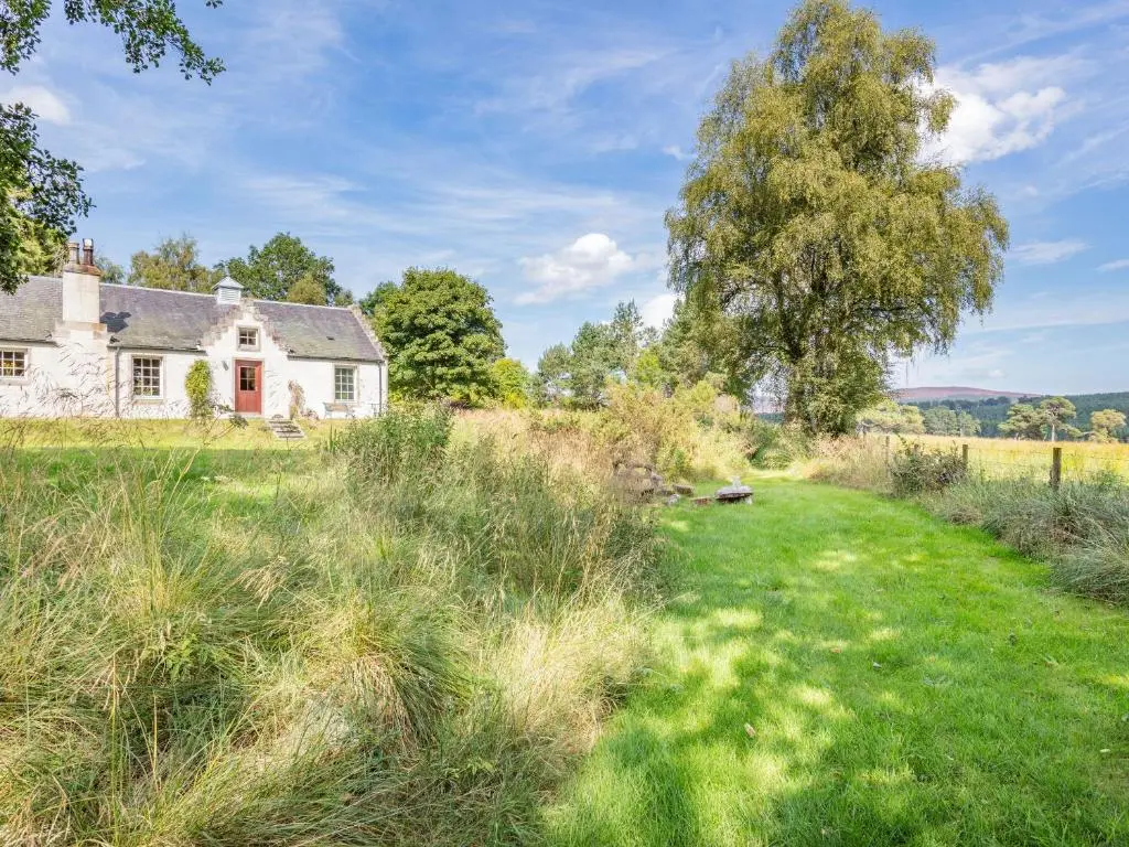 an old house in the middle of a field at The Old Laundry in Grantown on Spey