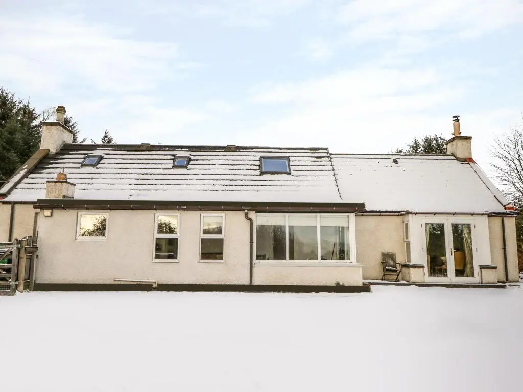 a house with a snow covered roof at Newlands in Archiestown