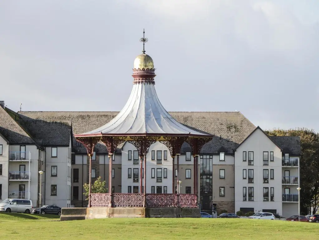 a large building with a gazebo in front of it at Seaview in Nairn