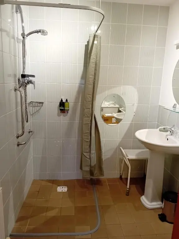 a bathroom with a shower and a sink at Deveron Lodge B&B in Turriff