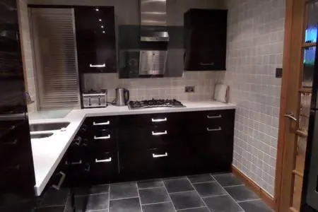 a kitchen with a sink and a stove at Jane's Place Free Parking in Inverness