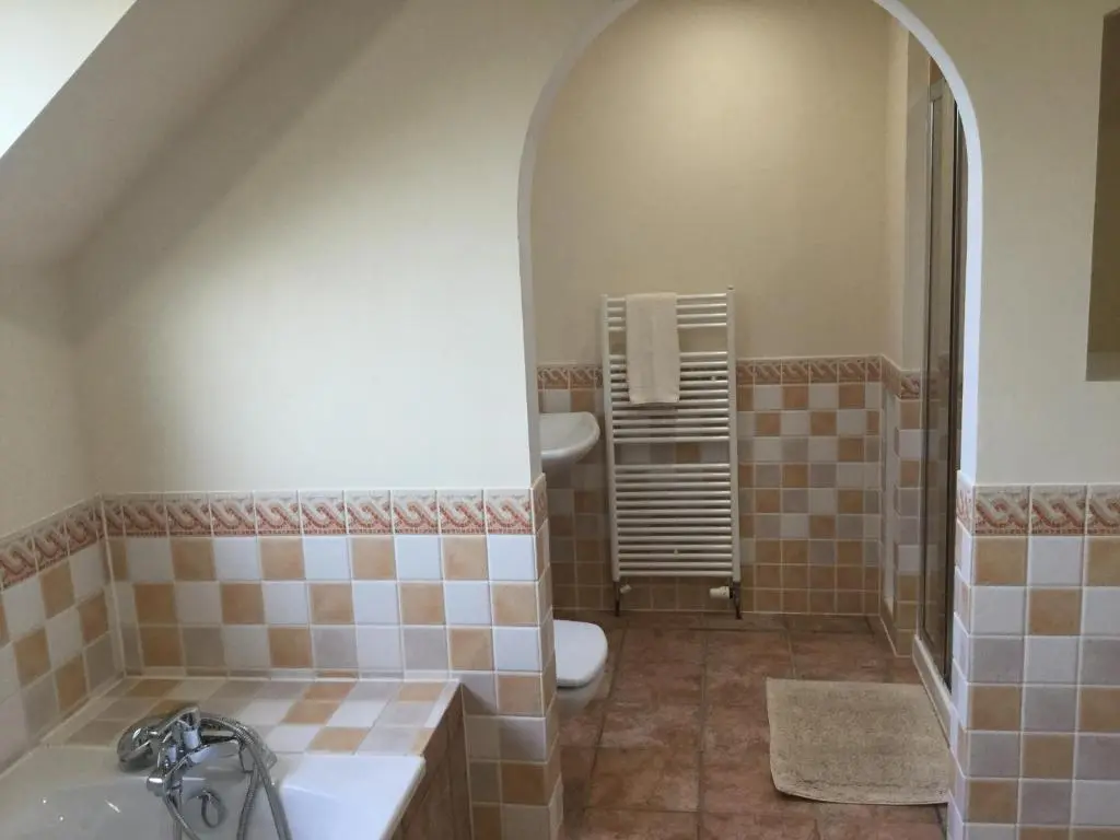 a bathroom with a toilet and a sink at West Heather House Free Parking in Inverness