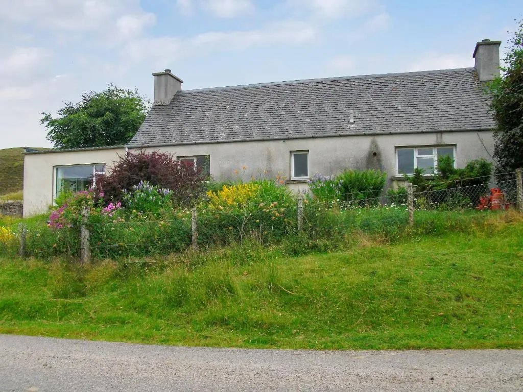 a house on the side of a road at Lower Brae in Achnahanat