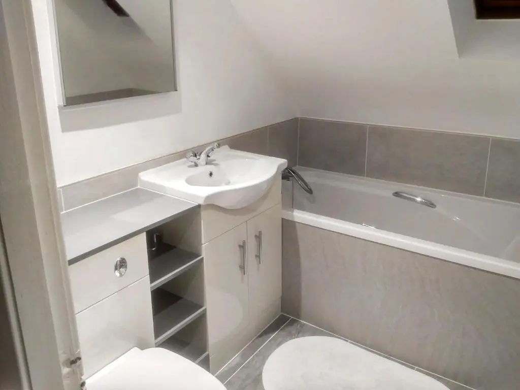 a bathroom with a sink and a tub and a toilet at Jebel in Cullen