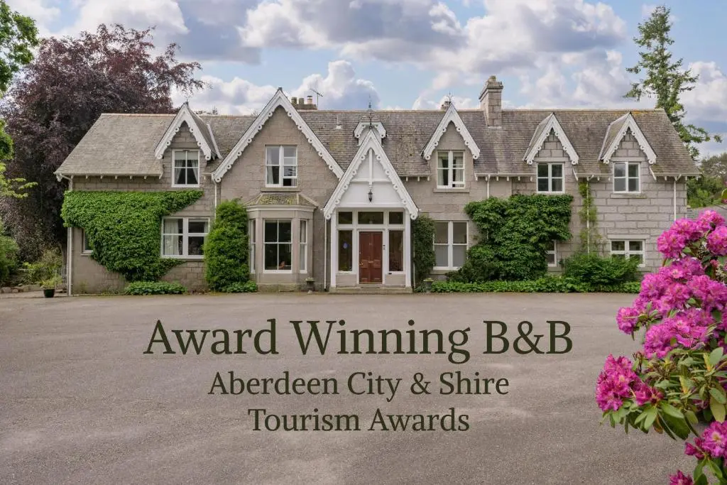 a house with the words award winning bbb aberdeen city and shine tourism awards at No 45, Ballater in Ballater
