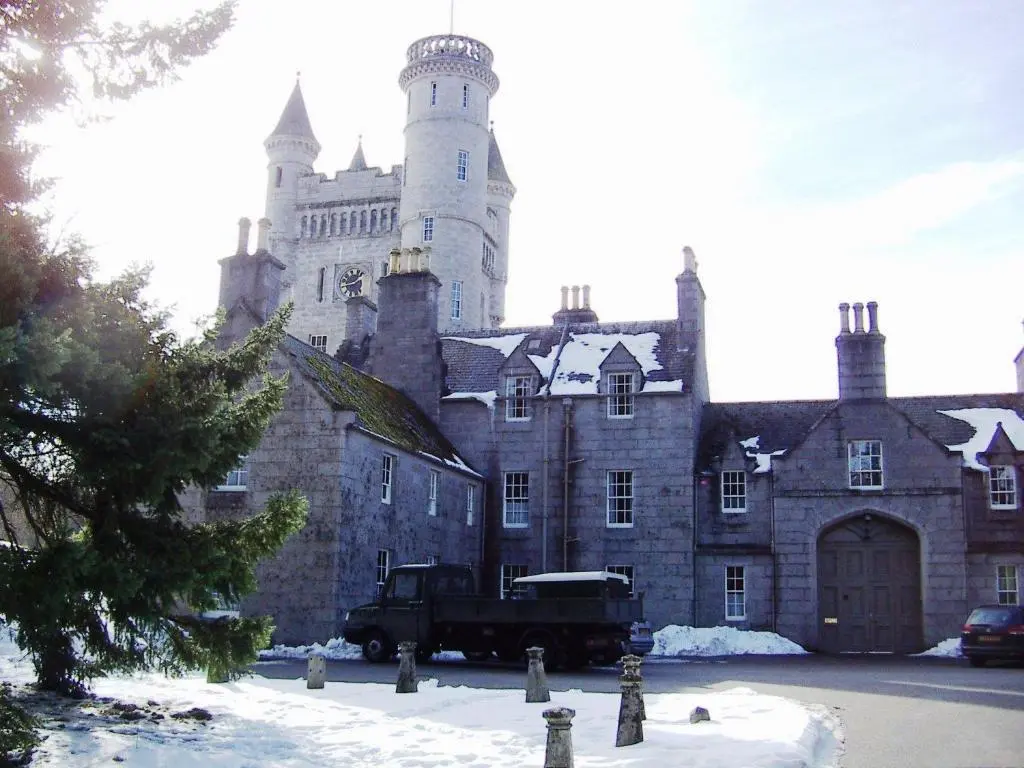an old castle with a truck parked in front of it at No 45, Ballater in Ballater