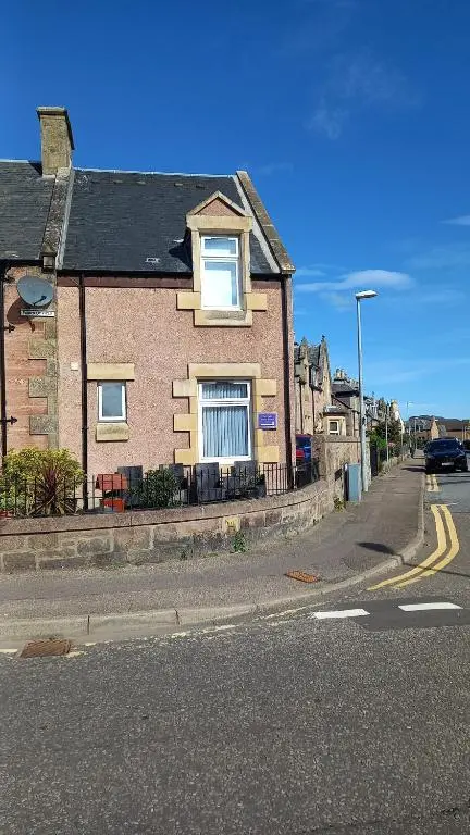 a brick house on the side of a street at Fairfield Townhouse Guest House in Inverness