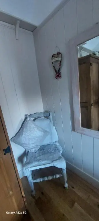 a room with a bed in a room with a window at Fairdene Cottage in Ballater