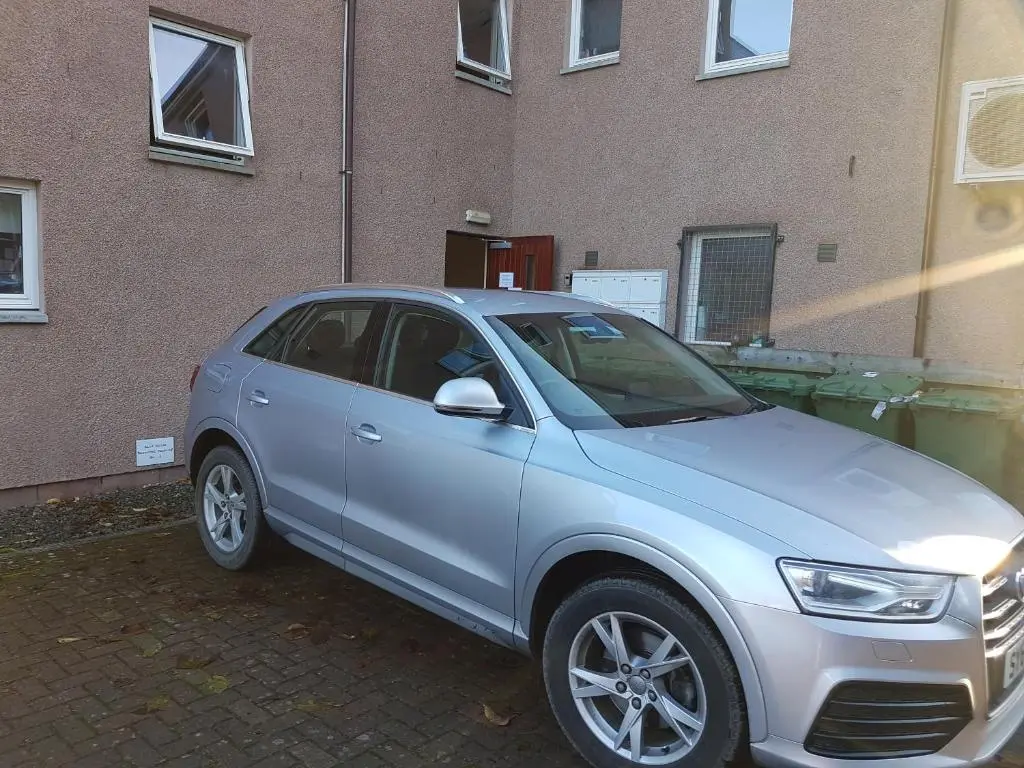 a silver car parked in front of a building at No.3 On The Square in Beauly