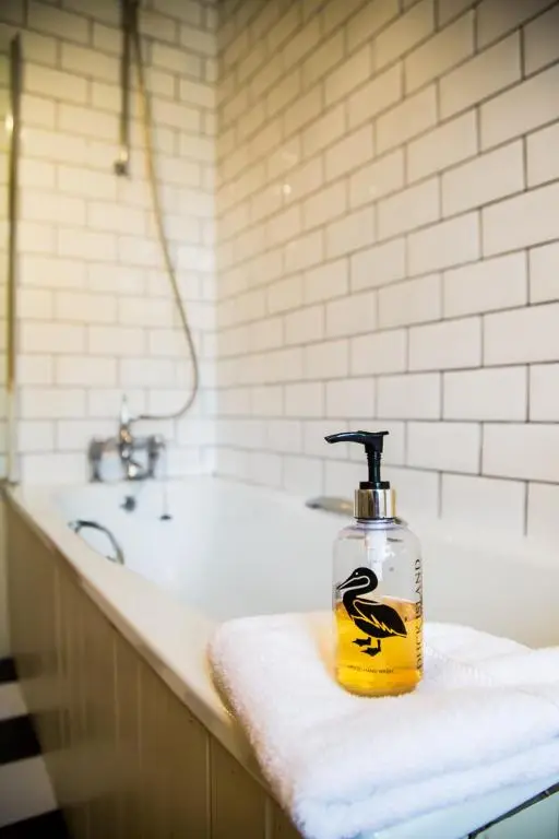 a bathroom with a bottle of soap on a counter at Shieling in Aviemore