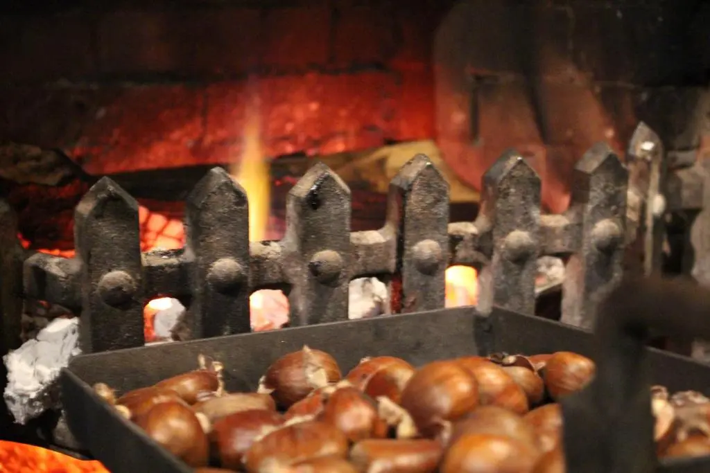 a bunch of chestnuts are cooking in a grill at Newmachar Hotel in Newmachar