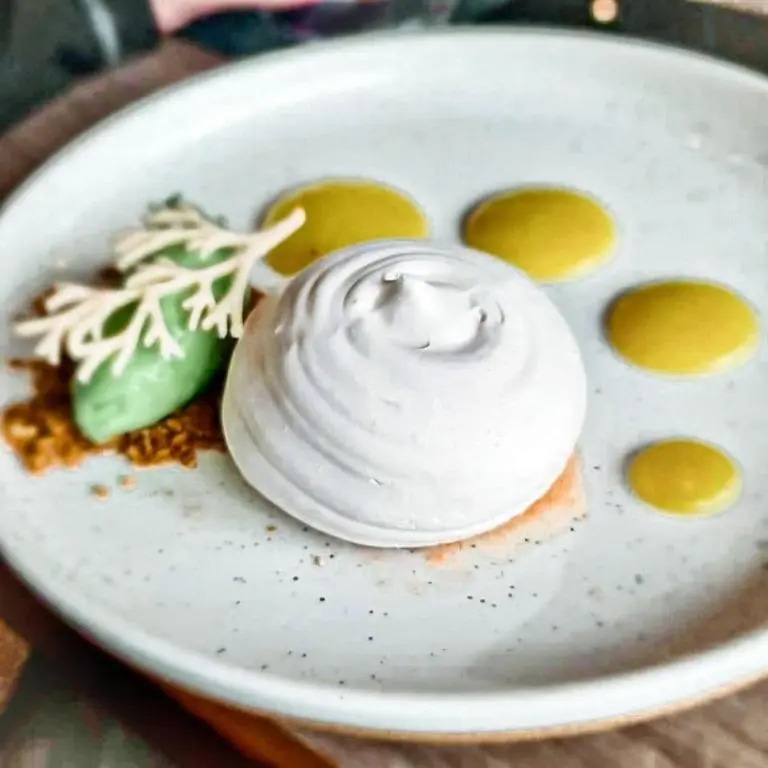 a plate of food with whipped cream on it at Newmachar Hotel in Newmachar