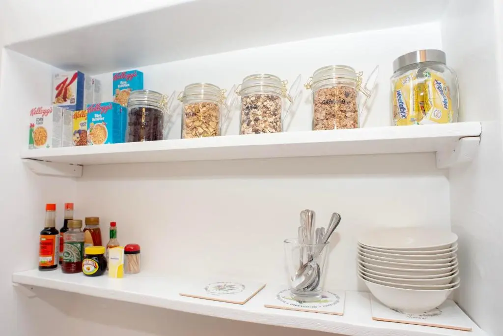 a white refrigerator shelves filled with lots of food at Dunvegan Bed & Breakfast in Dufftown