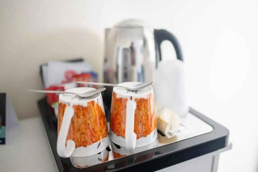 a counter with two containers of food and a juicer at Loch Ness Clansman Hotel in Drumnadrochit