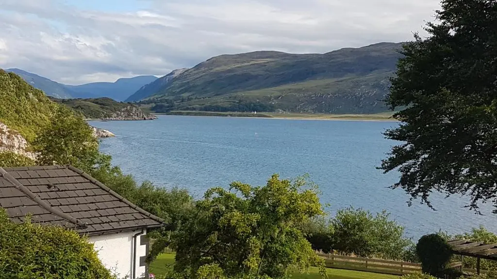 a view of a lake with mountains in the background at Lochview Guest House in Ullapool