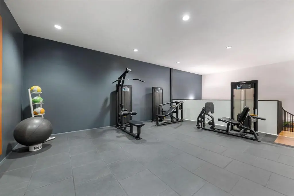 a gym with several treadmills and elliptical machines at Hilton Grand Vacations Club Craigendarroch Suites Scotland in Ballater