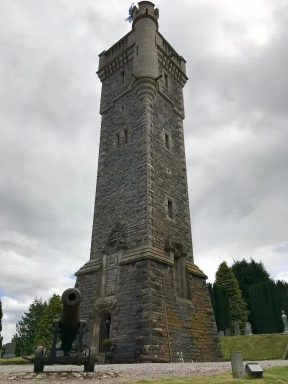 a tall brick tower with a cannon on top at Rosemount Bothy - Highland Cottage in Garve
