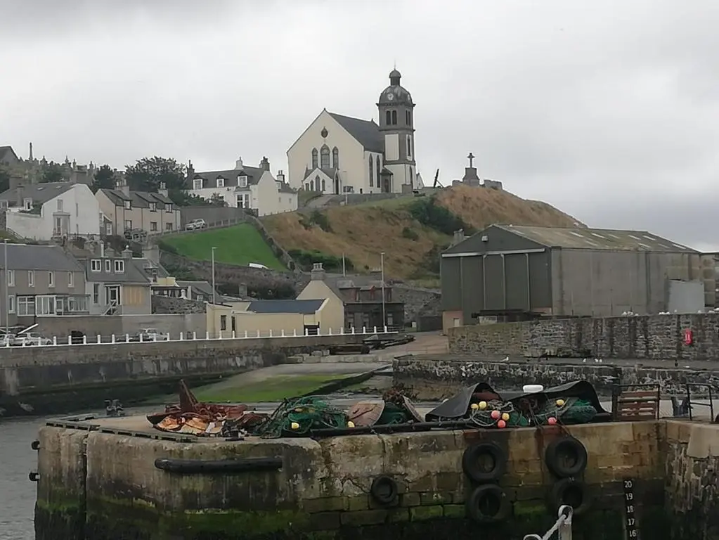 a view of a town with a church on a hill at 5A Union Road in Macduff
