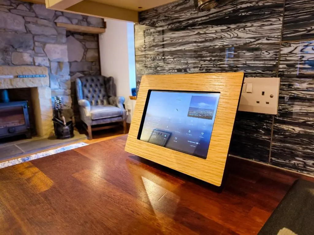a television sitting on the floor in a living room at Cullen 117 Seatown With Sea Views in Cullen