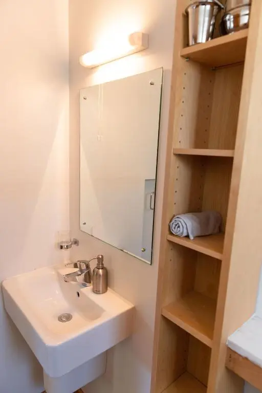 a bathroom with a sink and a mirror at Schoolhouse in Ballater