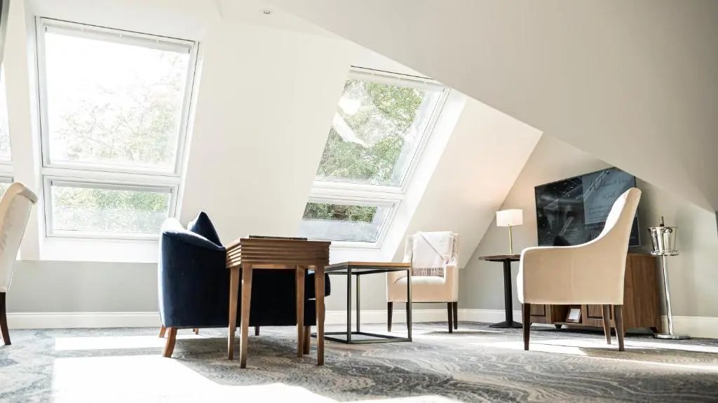 a living room with chairs and a table at Ness Walk in Inverness