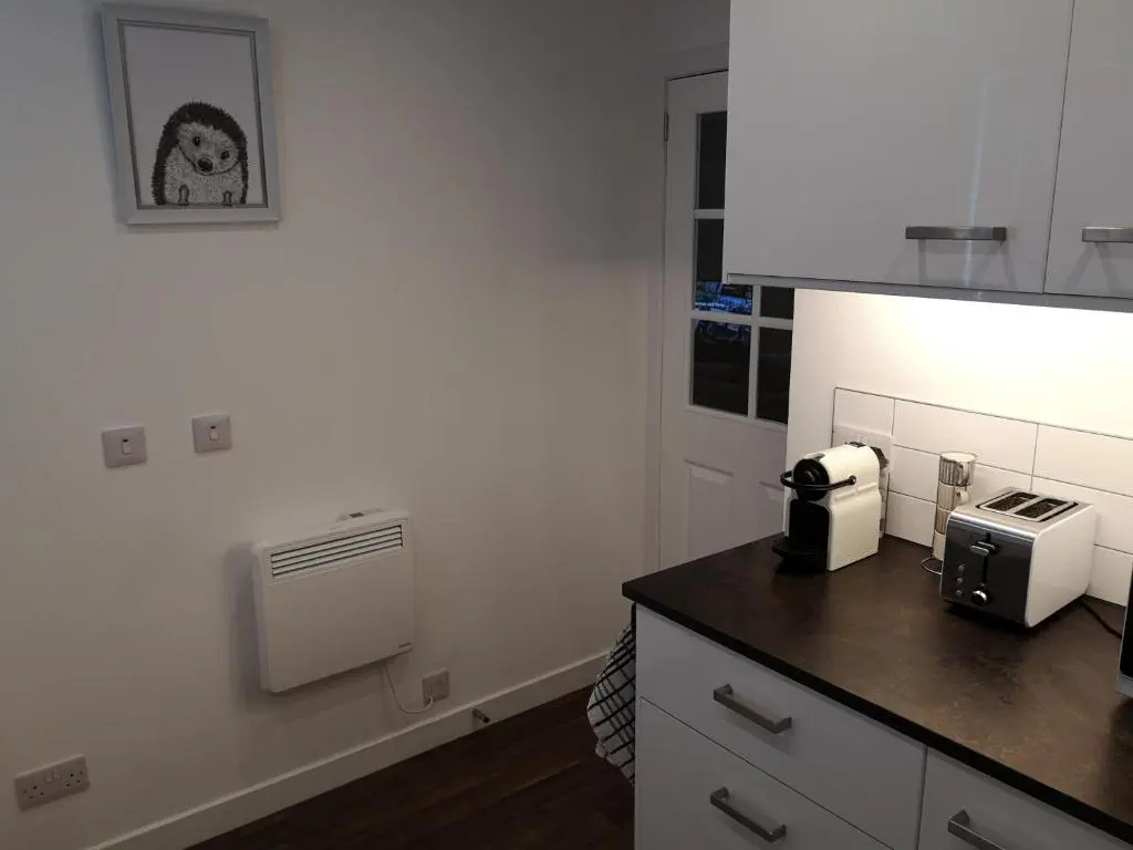 a kitchen with a counter with a coffee maker on it at The Hedgehogs in Inverness