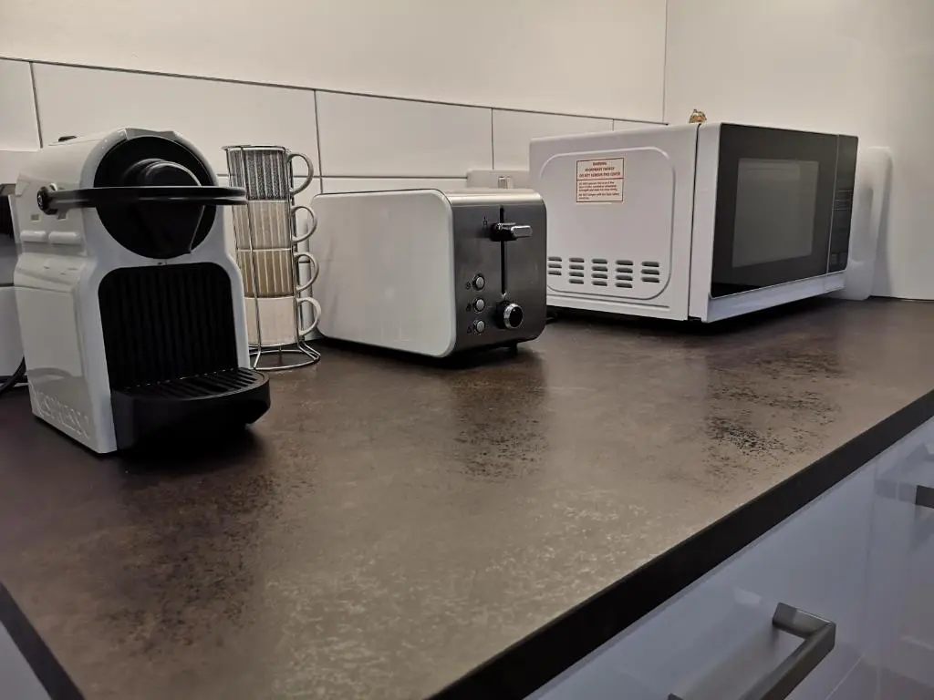 a kitchen counter with two microwaves and a microwave at The Hedgehogs in Inverness