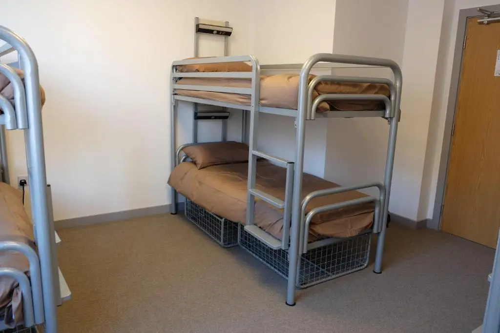 a couple of bunk beds in a room at Black Isle Hostel in Inverness