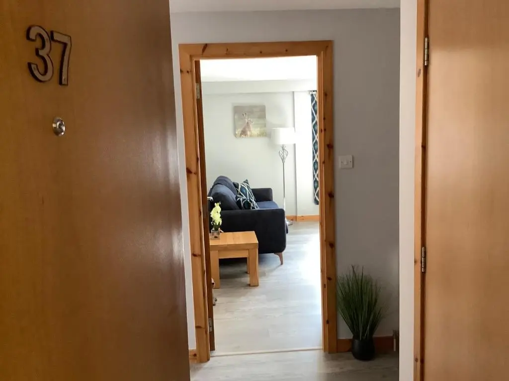 a view of a living room from the hallway at 37 Farraline Court, City Centre apartment in Inverness