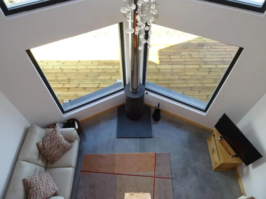 an overhead view of a living room with a large window at The Loft at Log Ness in Foyers