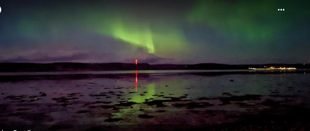 an image of the aurora in the sky over a lake at No.9 in Inverness