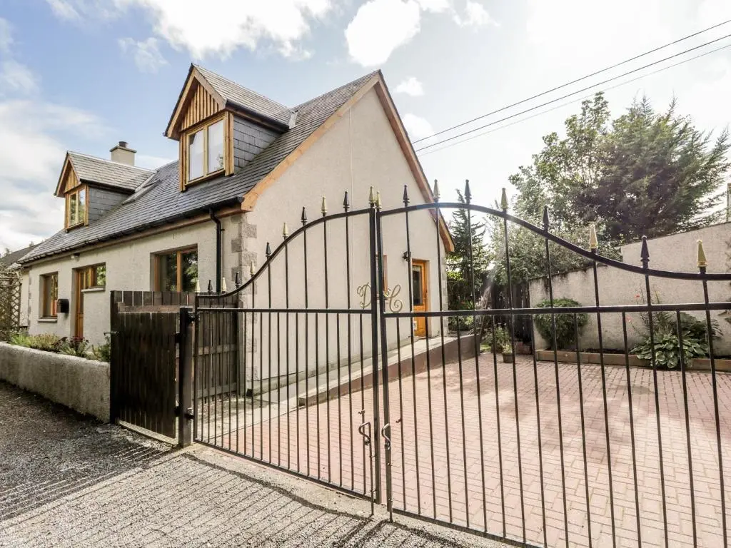 a gate in front of a house at Dolce Casa in Grantown on Spey