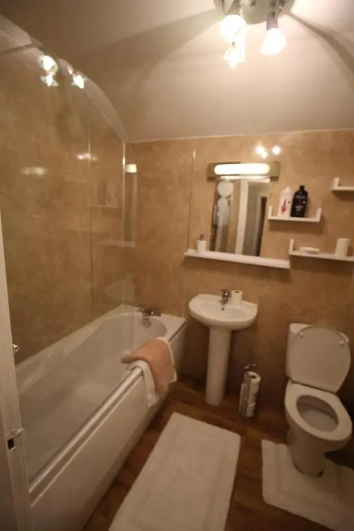a bathroom with a tub and a toilet and a sink at 63 Argyle Street in Inverness