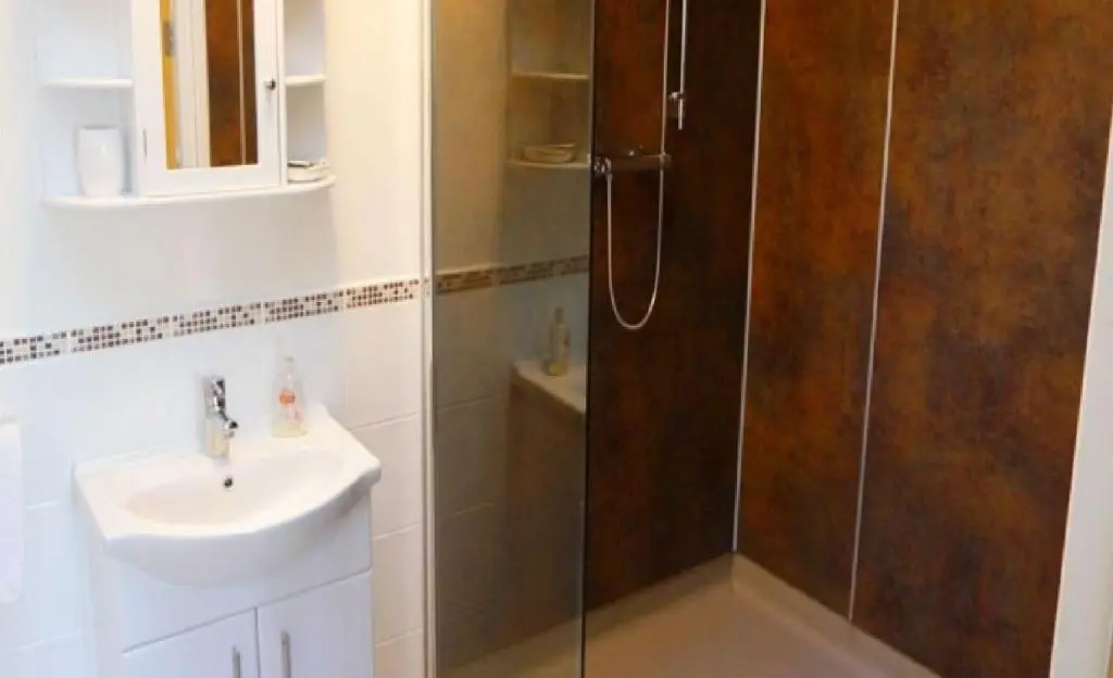 a bathroom with a shower and a sink at Ban Car Hotel in Cairness