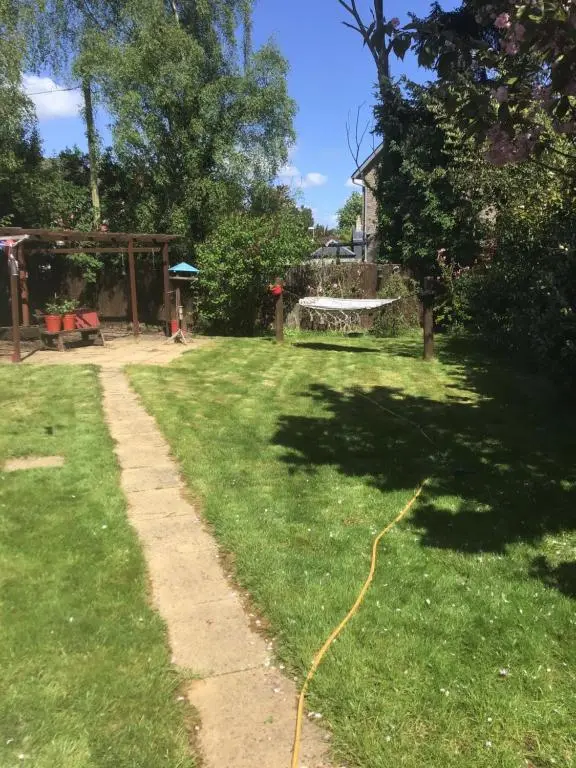 a garden with a hose on the grass at Alba b & b in Inverness