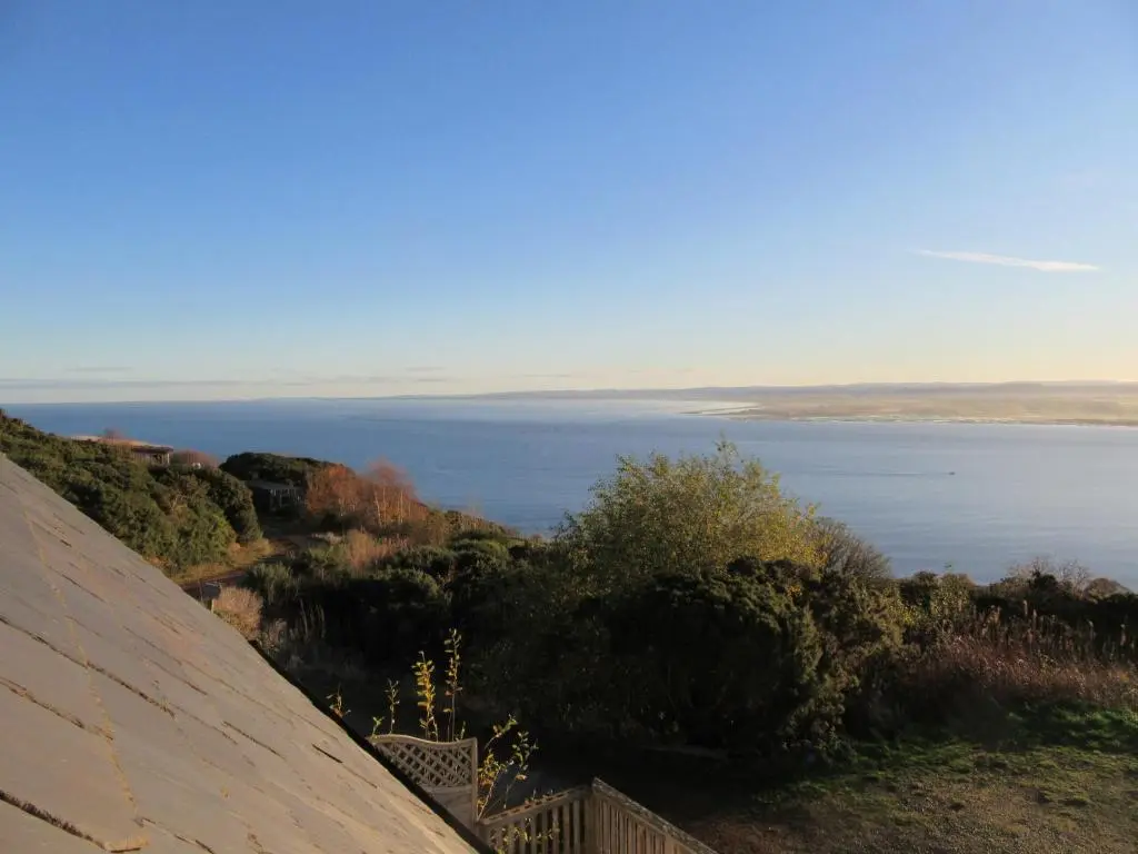 a view of a body of water from a roof at Osprey, Longhouse Cottages in Rosemarkie
