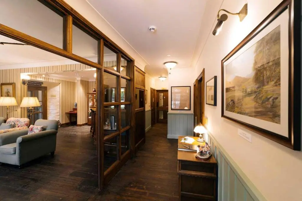 a living room with a couch and a table at Rokeby Manor in Invergarry