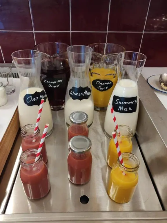 a bunch of different types of milkshakes on a counter at Rokeby Manor in Invergarry